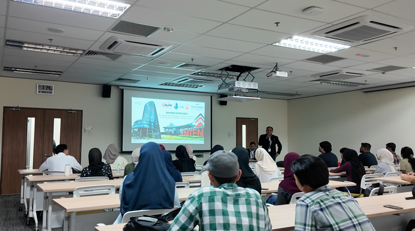 Energy and GHG awareness training session at MENARA MyIPO for UTeM students: attendees in a classroom while a presentation is shown
