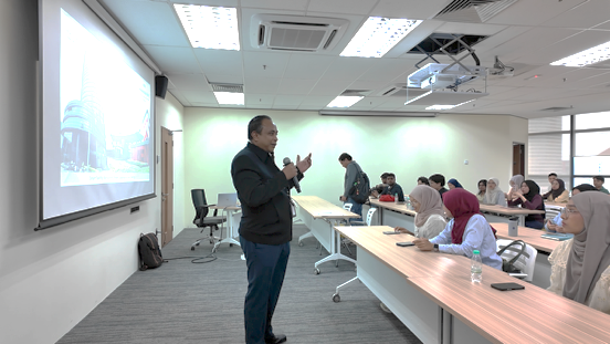 Energy and GHG awareness training session at MENARA MyIPO for UTeM students: presenter addressing seated attendees